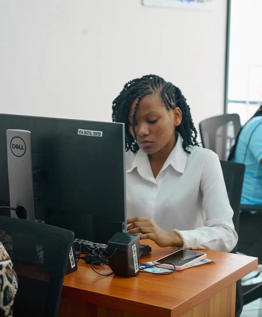 A trainee concentrating at a computer during class